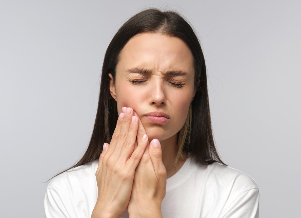 Woman in pain before dental resotration