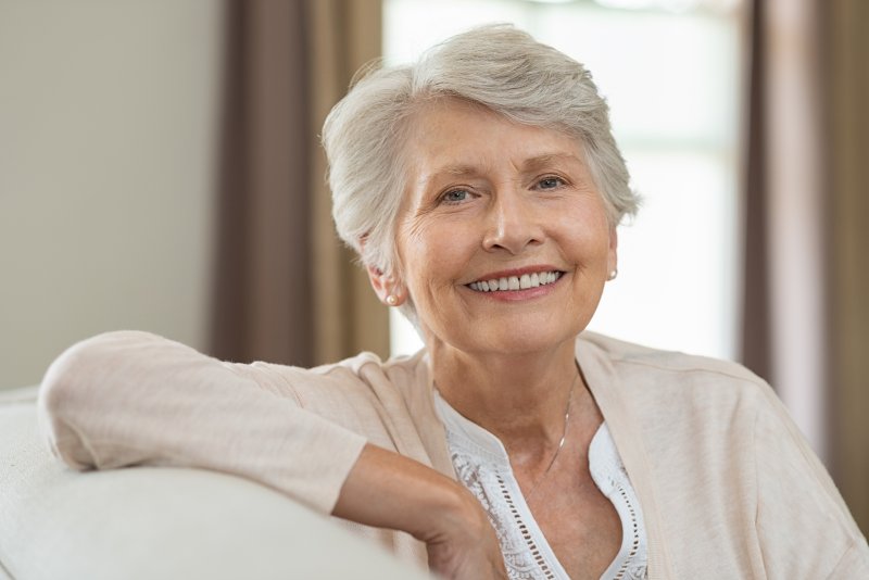 older woman with dental implants in Bonita Springs