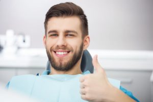 Man giving thumbs up after choosing cosmetic dentist in Bonita Springs
